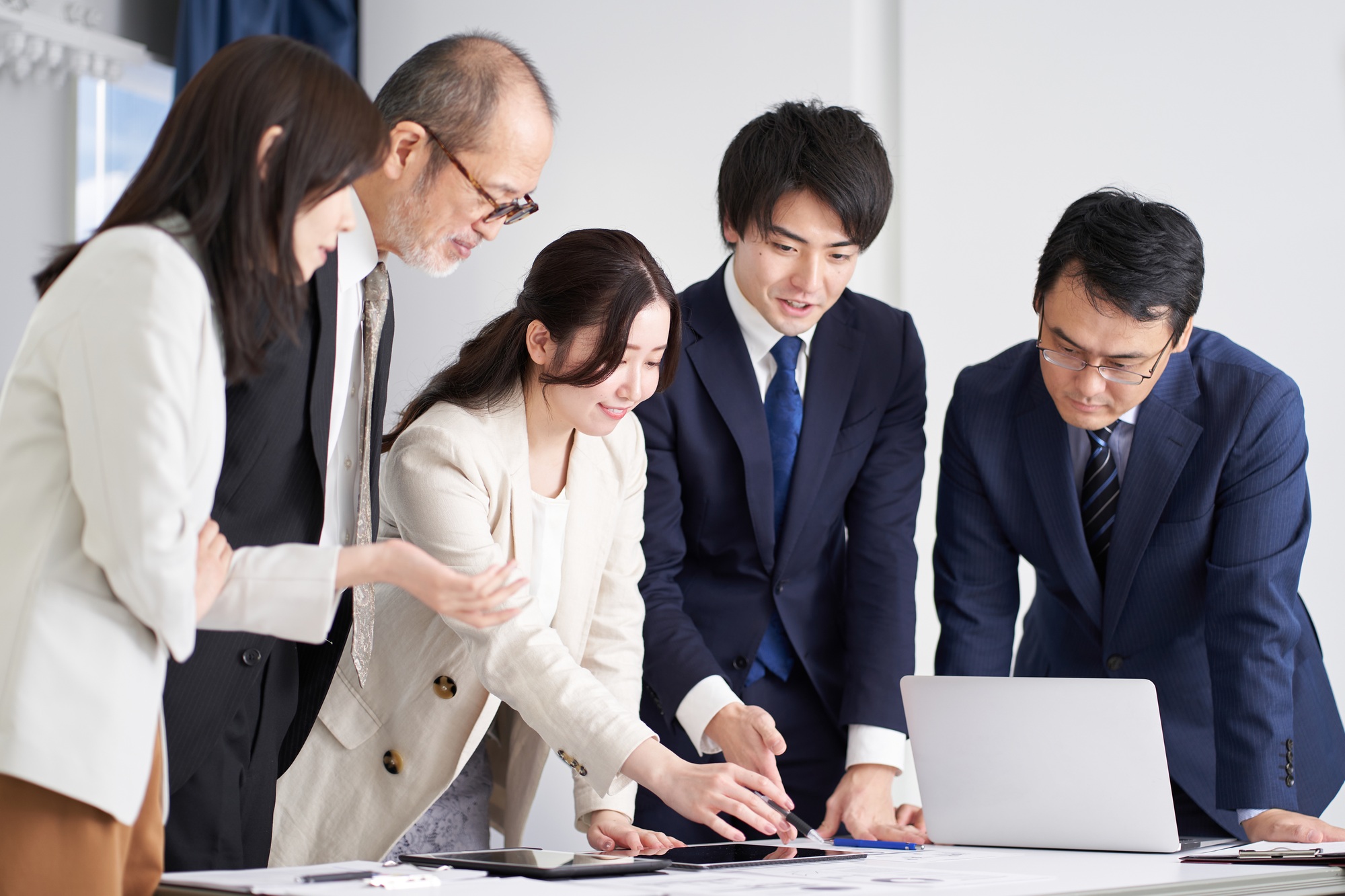 Asian business person explaining at a meeting