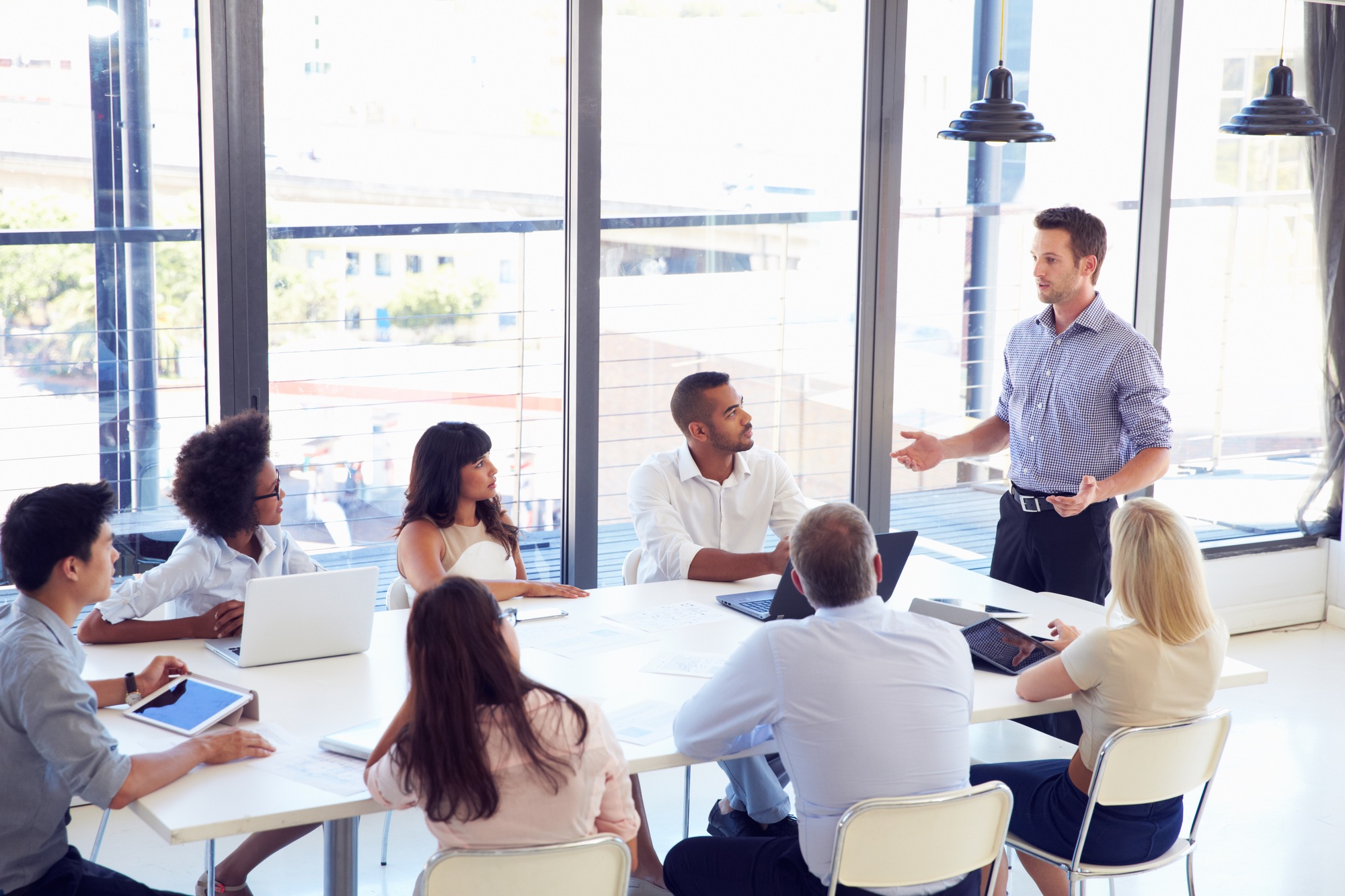 Businessman presenting to colleagues at a meeting