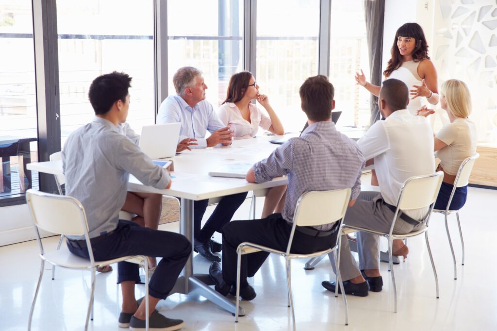 Businesswoman presenting to colleagues at a meeting